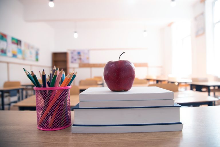 Pencils and books in the classroom. Education concept