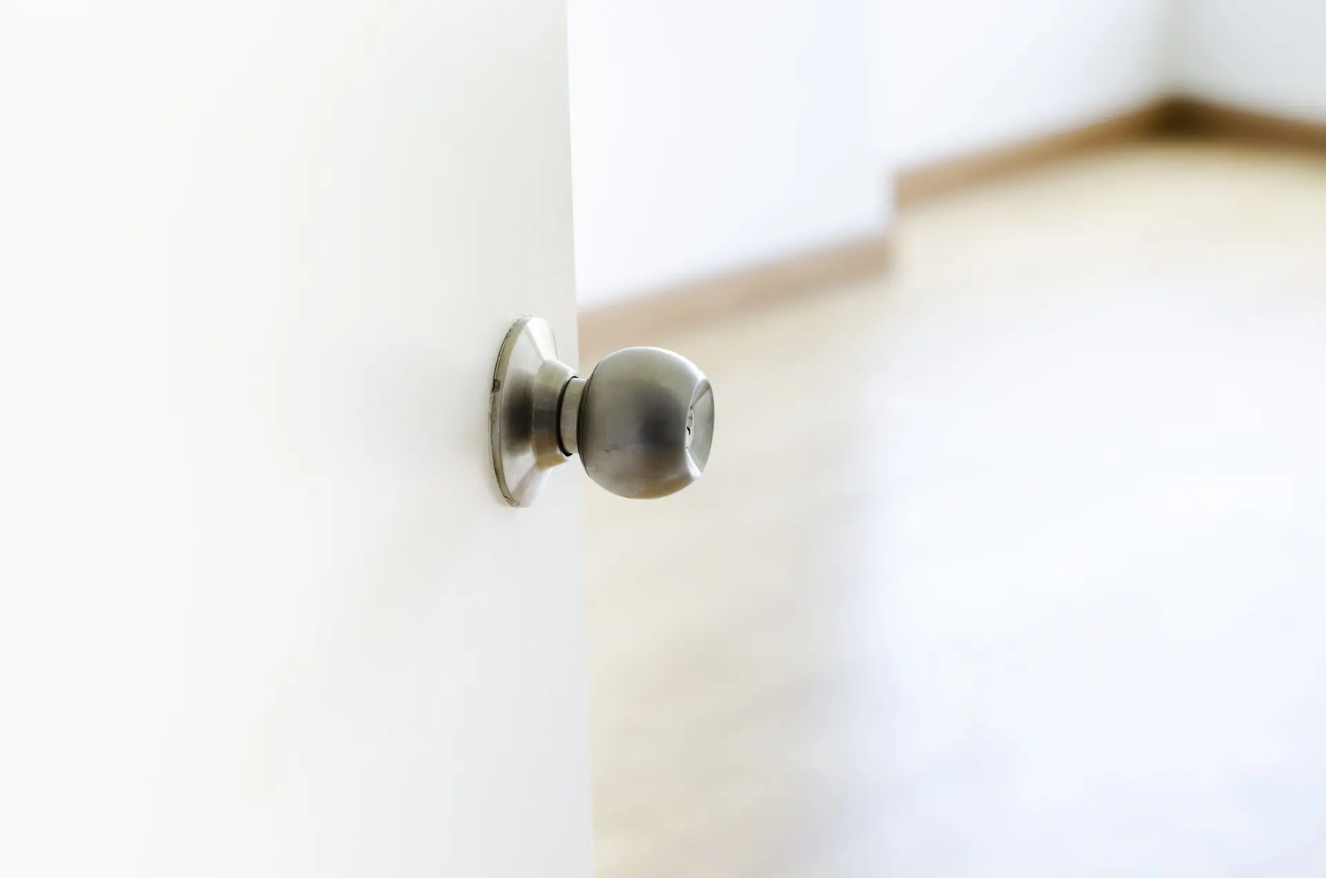 Close up, White Half-open door into room