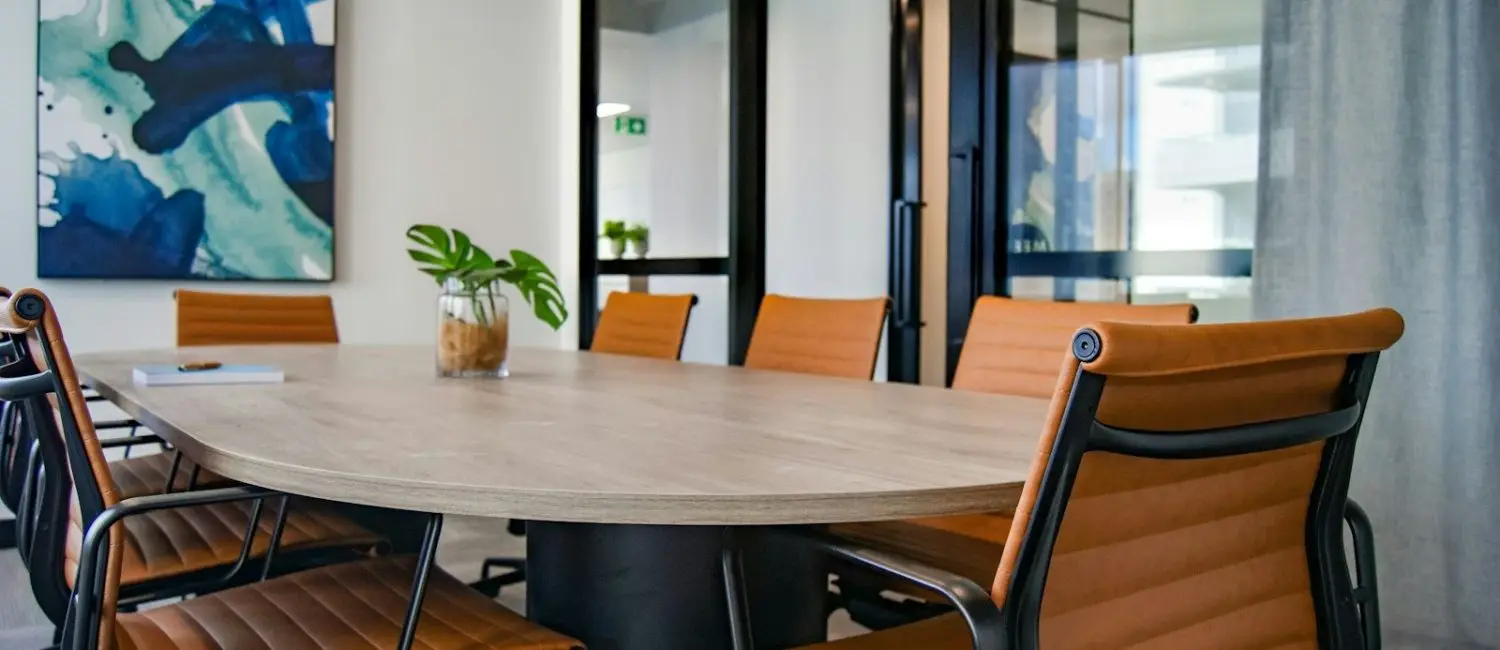 brown wooden 9-piece office table and chairs